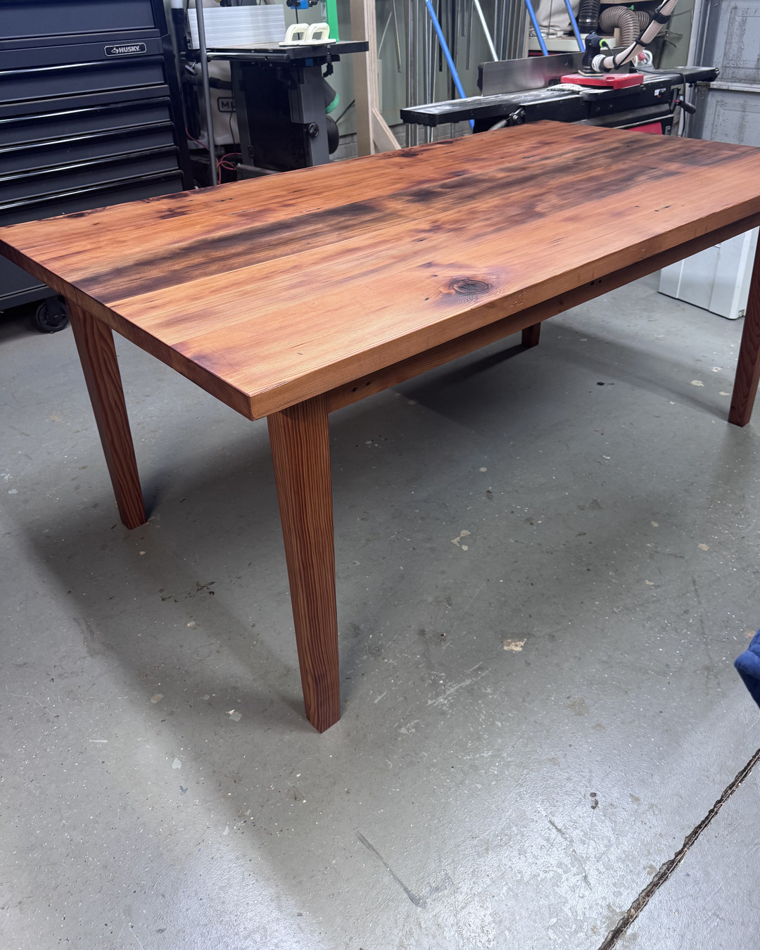 Reclaimed heart fir farm table with tapered legs, finished, in the Wood Sugar Company workshop