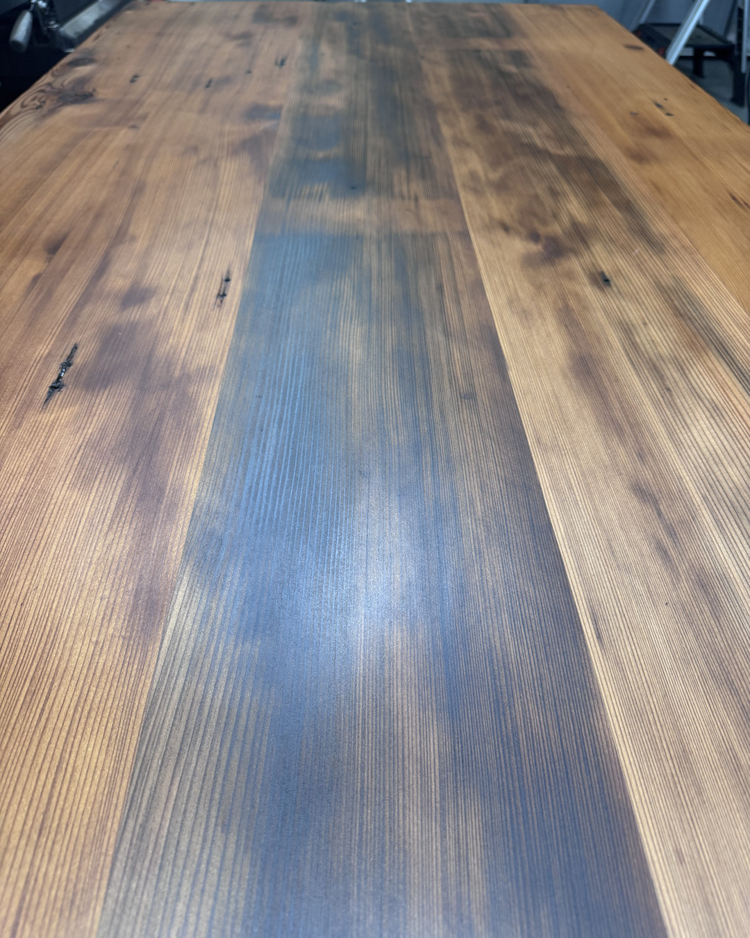 Close view of the heart fir table top showing grain and original nail holes