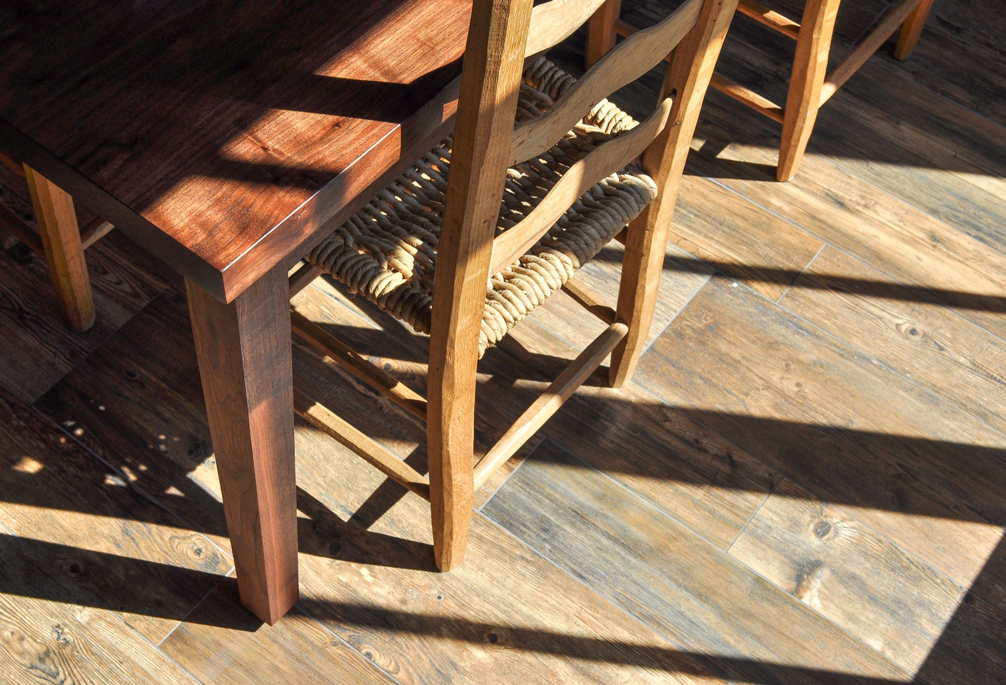 Walnut grain, ladder-back chair, shadow and contrast